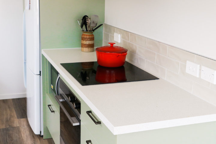 Close up of bench and cook top in newly renovated kitchen