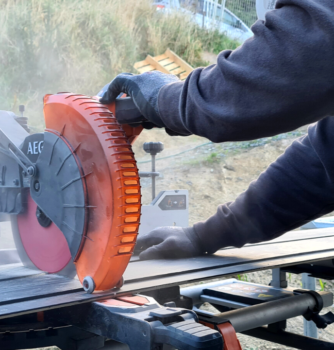 Table saw being used to cut construction materials on a building site